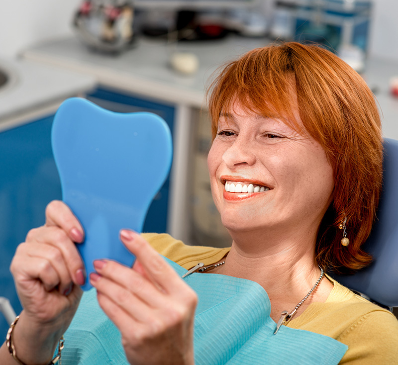 Patient Smiling after Restorative Treatment